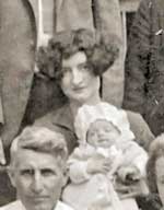 Zurah Hotchkin holding son Ward, Uncle Jim in foreground