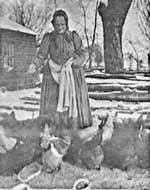 Susan Goss Witherell Pennock feeding the chickens
